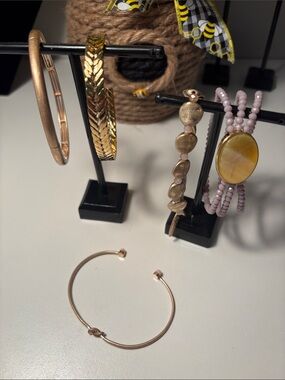 Set a five coordinating Gold tone over sterling silver bracelets